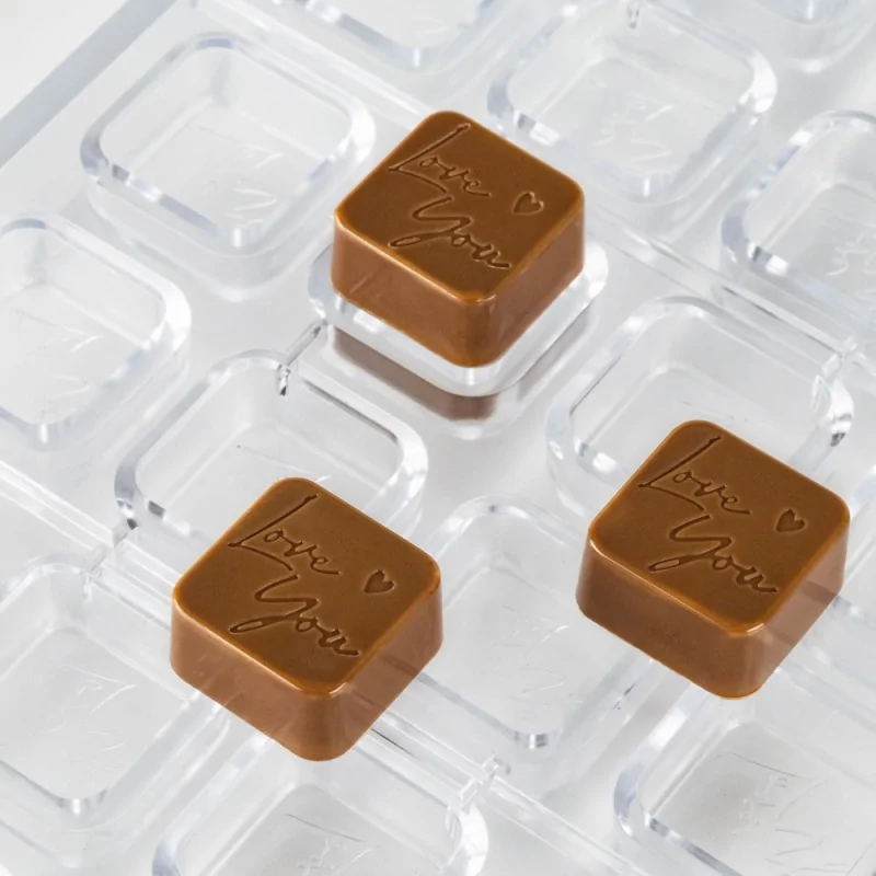 Professional Polycarbonate "Love You" Chocolate Mold - 28 mm x 28 mm h 14 mm - 11.5gr - 24 Cavities Professional Polycarbonate "Love You" Chocolate Mold - 28 mm x 28 mm h 14 mm - 11.5gr - 24 Cavities