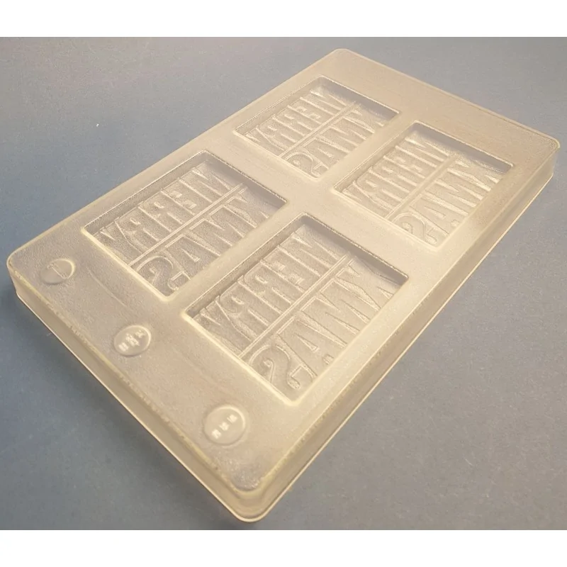 Thermoformed Polycarbonate Chocolate Tablet Mold - Merry Xmas - 4 cavity - 85 mm x 67.7 mm x h 7.8 mm -50gr Thermoformed Polycarbonate Chocolate Tablet Mold - Merry Xmas - 4 cavity - 85 mm x 67.7 mm x h 7.8 mm -50gr